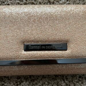 Damsel in Defense gold wallet
